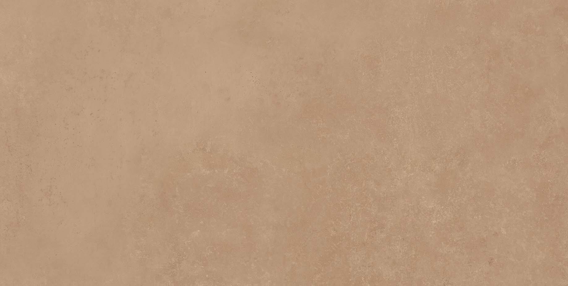 Beige-brown textured plaster wall background with a mottled finish.