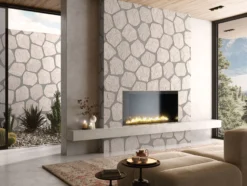 Contemporary living room with a stone-clad fireplace, low seating, and a mountain-view window scene outside the glass walls.