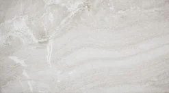 Light gray concrete wall with subtle white veining and rough texture.