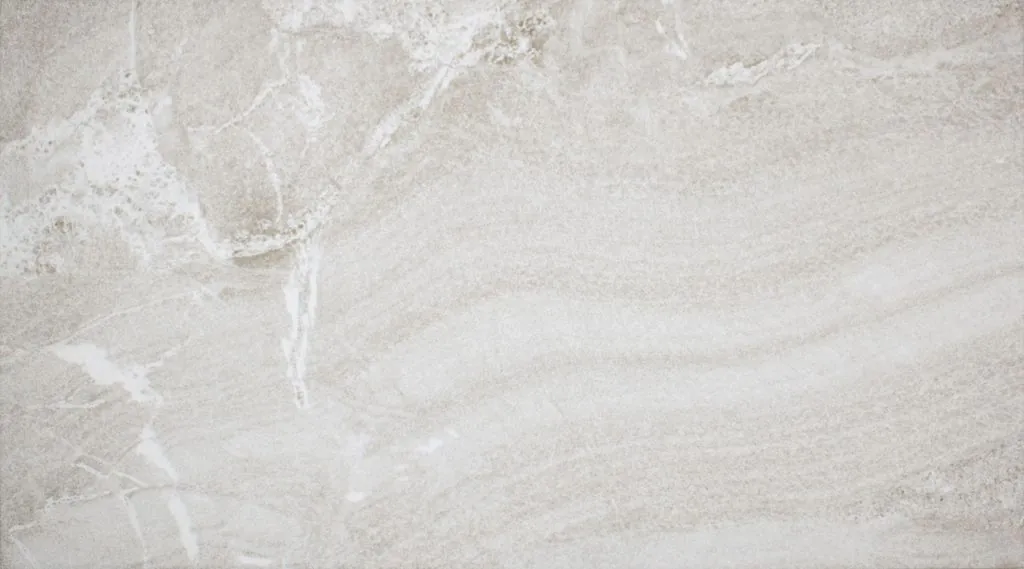 Light gray concrete wall with subtle white veining and rough texture.